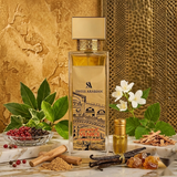 "A perfume bottle labeled 'Passion of Venice' by Swiss Arabian, styled with green leaves, white flowers, black and pink pepper, spices, and other fragrance ingredients against a warm golden background with soft lighting."