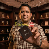 Perfumes Stop owner holding a bottle of Swiss Arabian Tobacco 01 Extrait de Parfum