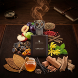 Swiss Arabian Tobacco 01 Extrait de Parfum bottle displayed on a dark brown leather mat surrounded by its scent ingredients, including tobacco leaves, vanilla, amber honey, spices, and fruits, with a steaming effect above the bottle.