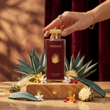 "Tequila Pour Femme EDP Spray 3.3oz + 0.17oz / 100ml + 5ml perfume bottle displayed with a burgundy box and decorative accessories."