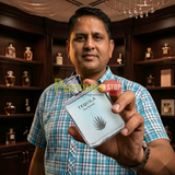 "Perfumes Stop owner holding a bottle of Tequila Pour Homme EDP Spray 3.3oz / 100ml."