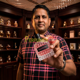 "Perfumes Stop owner holding a bottle of Valentino Born in Roma Donna Eau de Parfum"