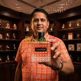 "Perfumes Stop owner holding a bottle of Valentino Born in Roma Donna Coral Fantasy Eau de Parfum"