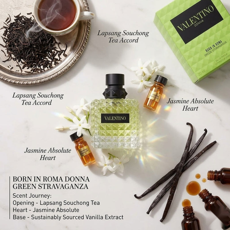 "A perfume bottle labeled 'Born in Roma Donna Green Stravaganza' by Valentino, styled with green tea leaves, jasmine, vanilla, and other fragrance ingredients against a fresh green background with soft lighting."