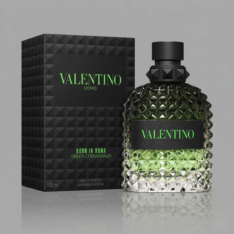 "A perfume bottle labeled 'Born in Roma Uomo Green Stravaganza' by Valentino, styled with Calabrian bergamot, coffee, vetiver, and other fragrance ingredients against a dramatic dark background with coffee beans, green citrus fruits, and warm lighting."